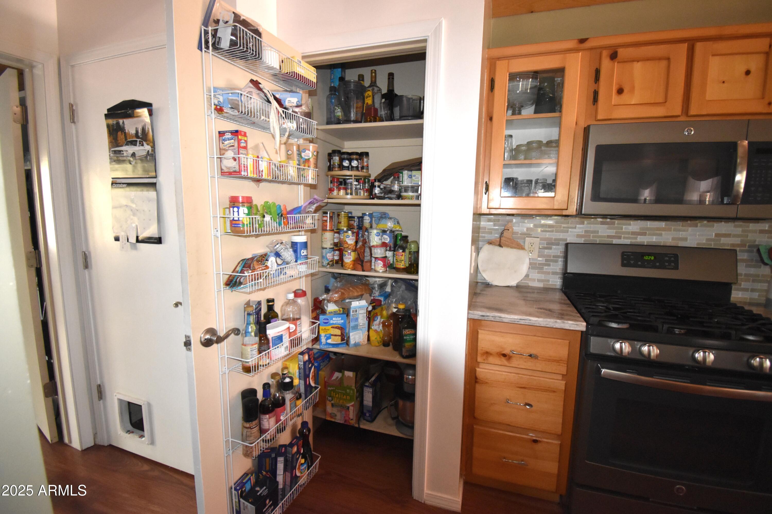 8742 Tonto Rim Drive Pine, AZ 85544 - Photo 15 of 41 a kitchen with stainless steel appliances granite countertop a refrigerator and a stove top oven