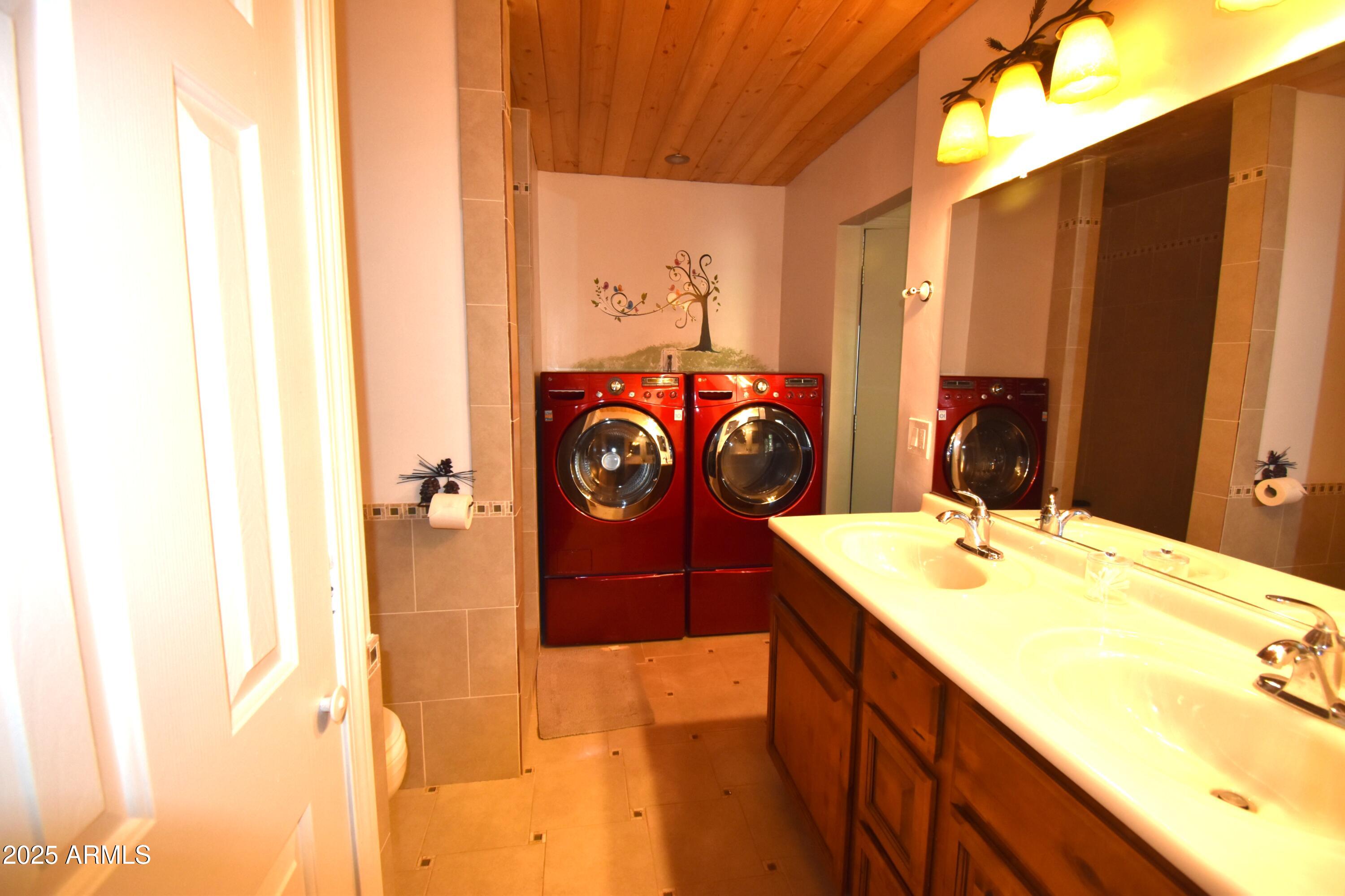8742 Tonto Rim Drive Pine, AZ 85544 - Photo 27 of 41 a bathroom with a sink and a mirror