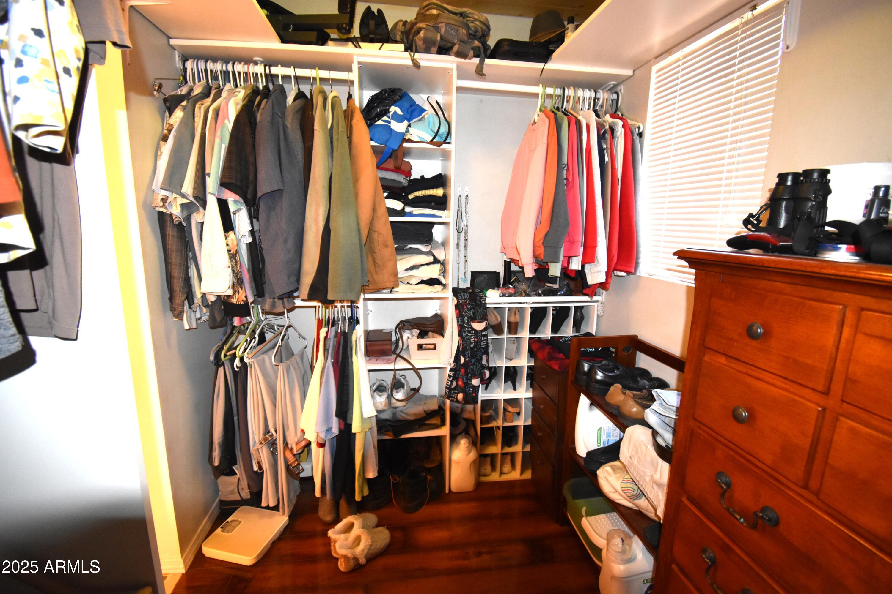 8742 Tonto Rim Drive Pine, AZ 85544 - Photo 30 of 41 a view of walk in closet with clothes and shoes