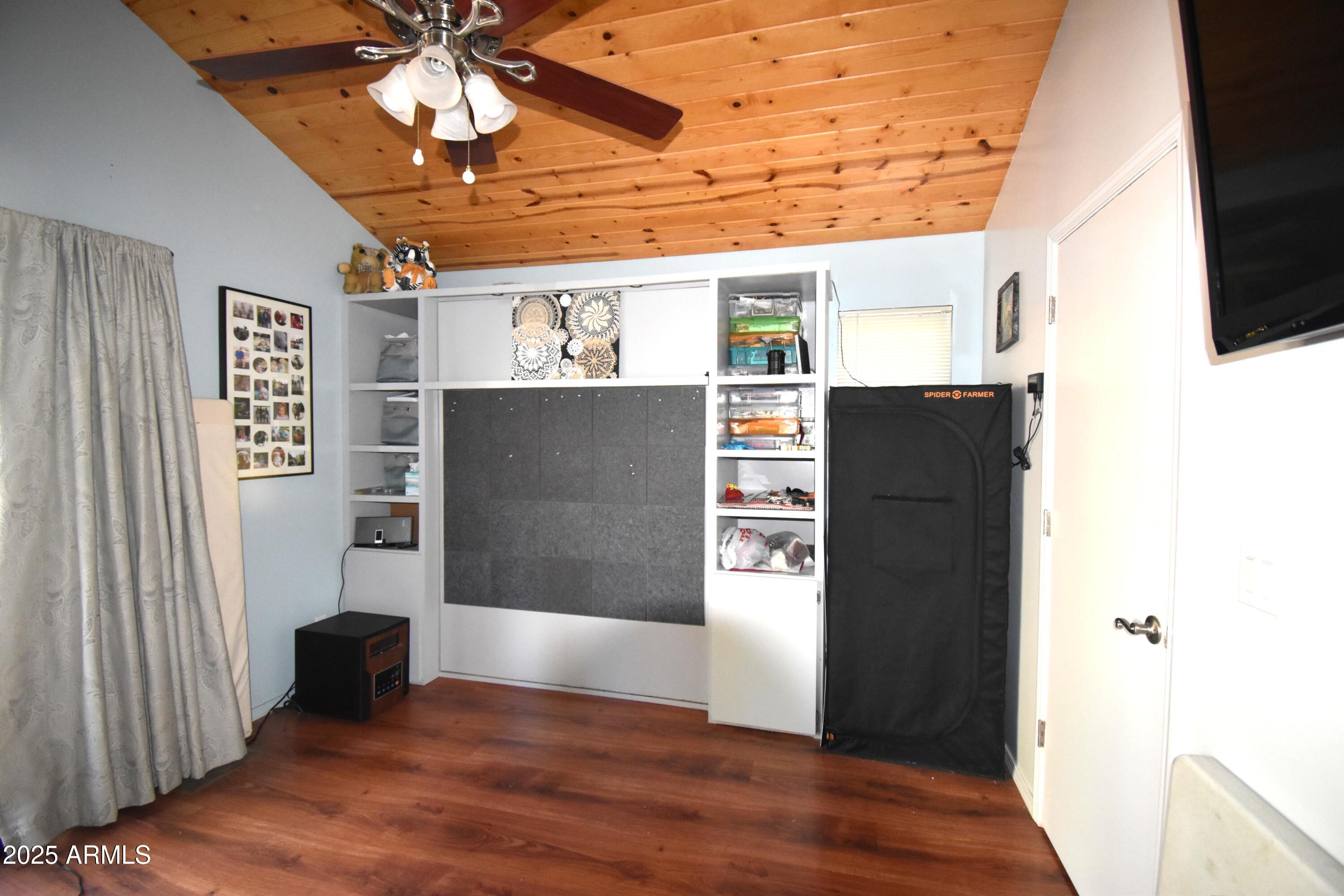8742 Tonto Rim Drive Pine, AZ 85544 - Photo 32 of 41 a view of a refrigerator in kitchen and an empty room