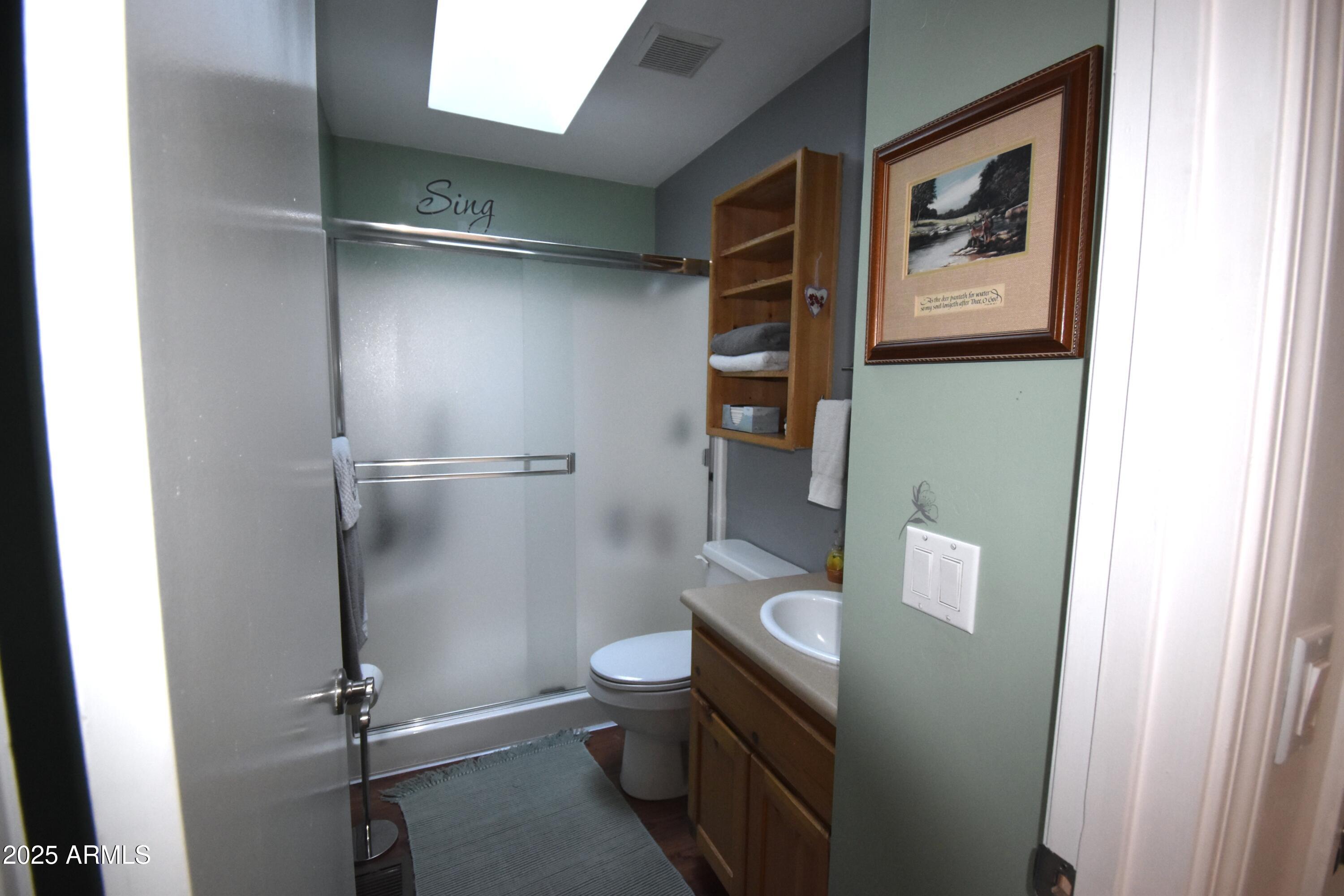 8742 Tonto Rim Drive Pine, AZ 85544 - Photo 35 of 41 a bathroom with a toilet and a shower