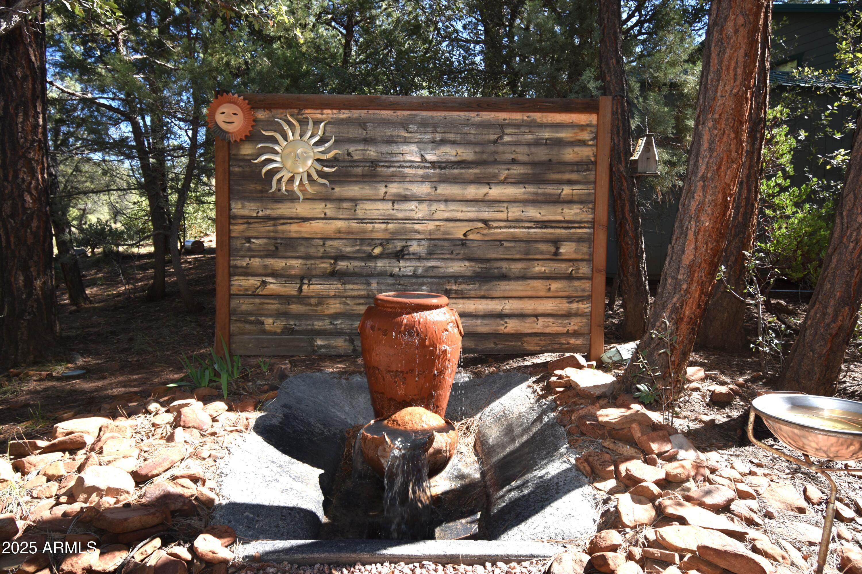 8742 Tonto Rim Drive Pine, AZ 85544 - Photo 38 of 41 a backyard of a house with outdoor seating