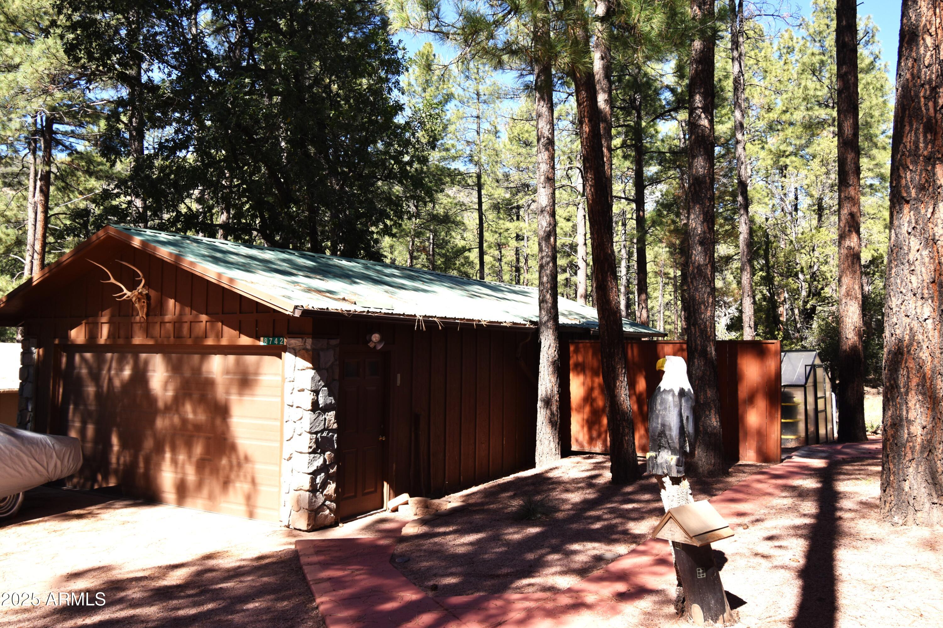 8742 Tonto Rim Drive Pine, AZ 85544 - Photo 39 of 41 a backyard of a house with lots of green space