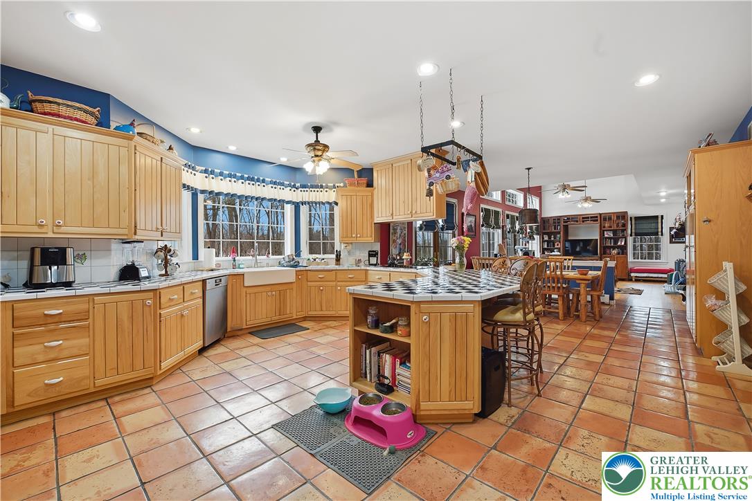 6688 Haasadahl Road Allentown, PA 18106 - Photo 14 of 33 a kitchen with stainless steel appliances granite countertop a stove and cabinets