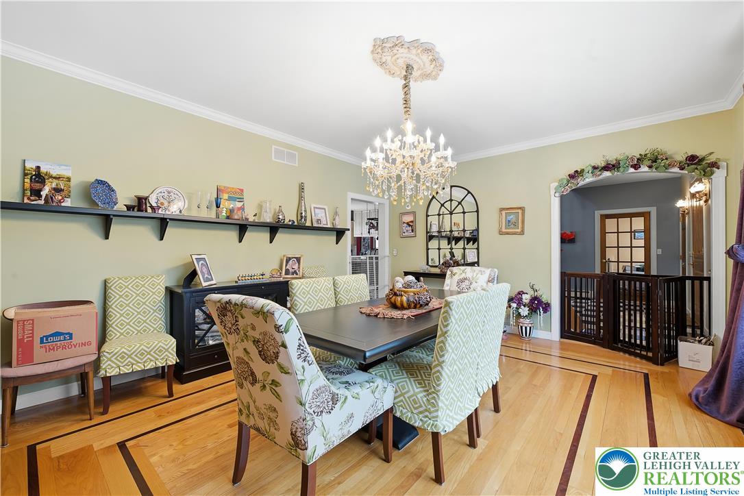 6688 Haasadahl Road Allentown, PA 18106 - Photo 8 of 33 a view of a dining room with furniture and a chandelier