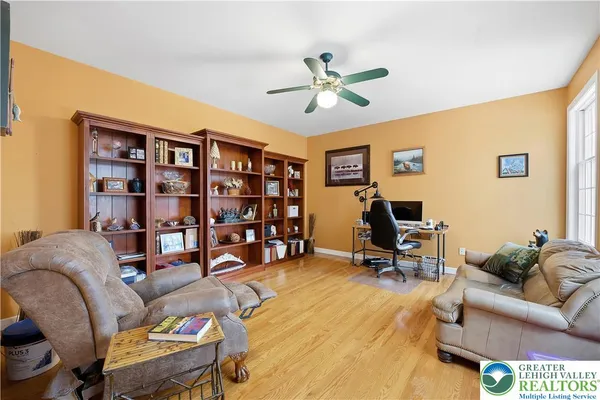 a living room with fireplace furniture and a fireplace