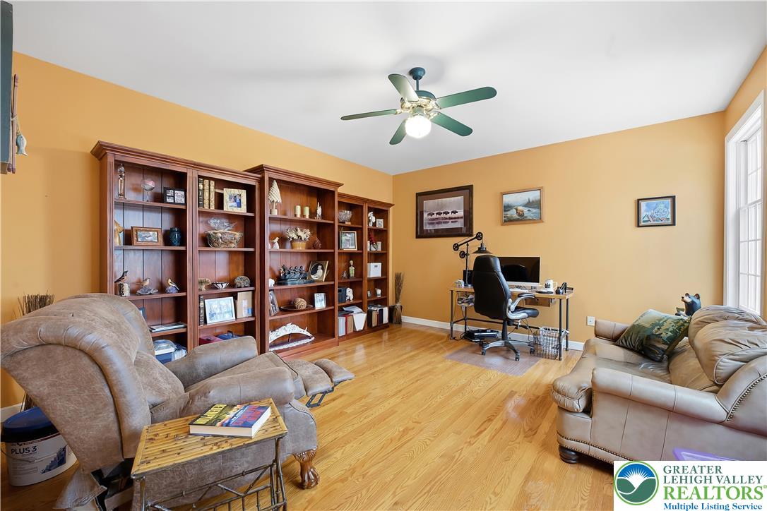 6688 Haasadahl Road Allentown, PA 18106 - Photo 9 of 33 a living room with fireplace furniture and a hard wood floor