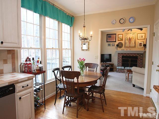 5944 Dunbarton Way Raleigh, NC 27613 - Photo 3 of 19 a view of a dining room with furniture window and wooden floor