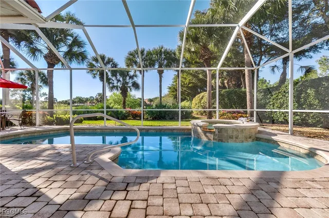 a view of a swimming pool with a lounge chairs