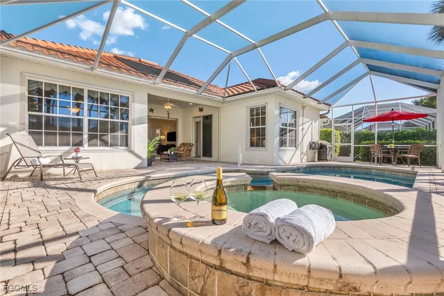 a dinning area with pool table and chairs