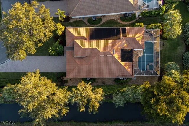 a view of a house with a yard and garden