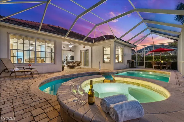 a swimming pool with patio outdoor seating and yard