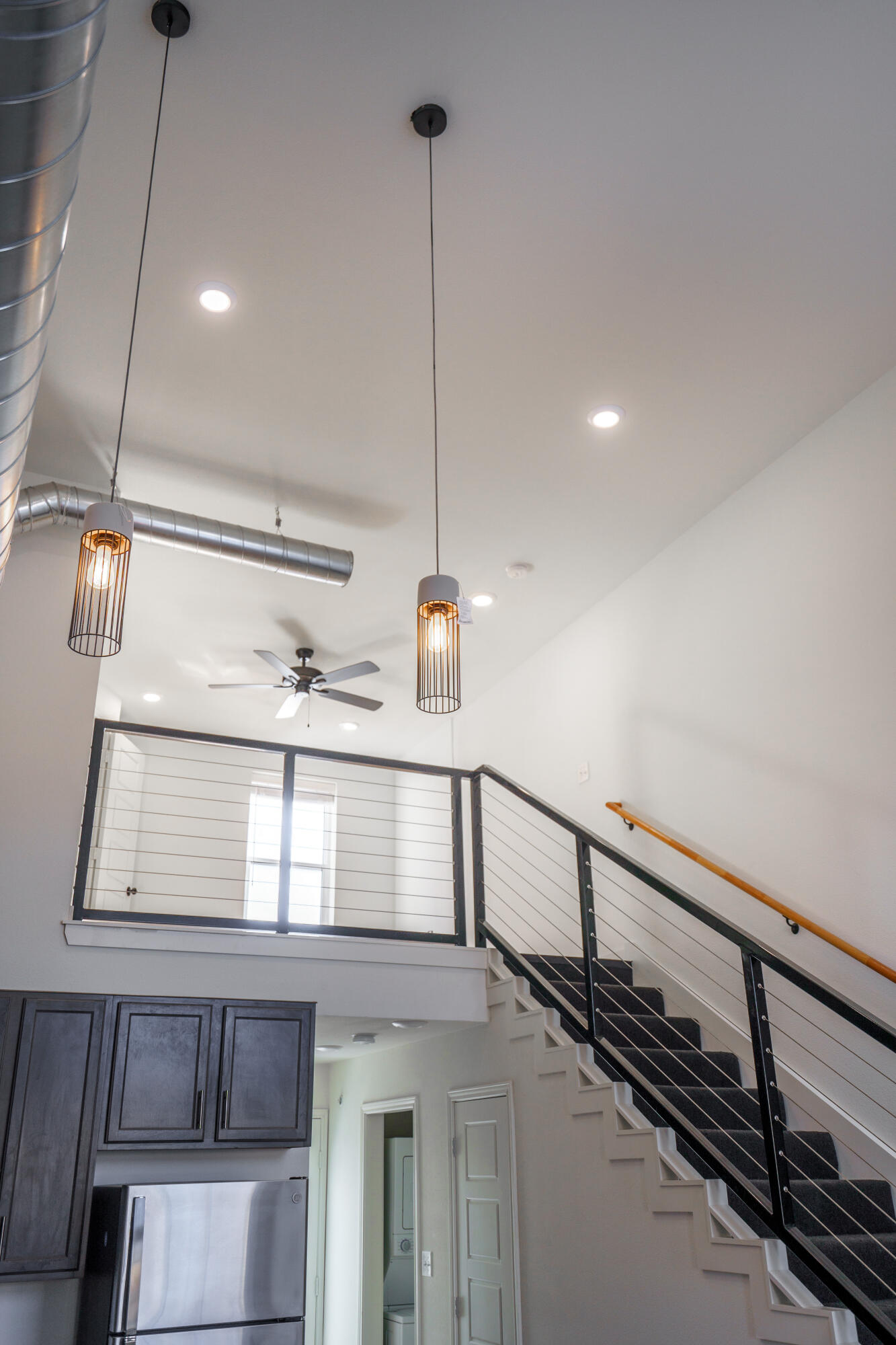 2007 Main Street, Unit 3 Lubbock, TX 79401 - Photo 14 of 23 a kitchen with a refrigerator a sink and cabinets