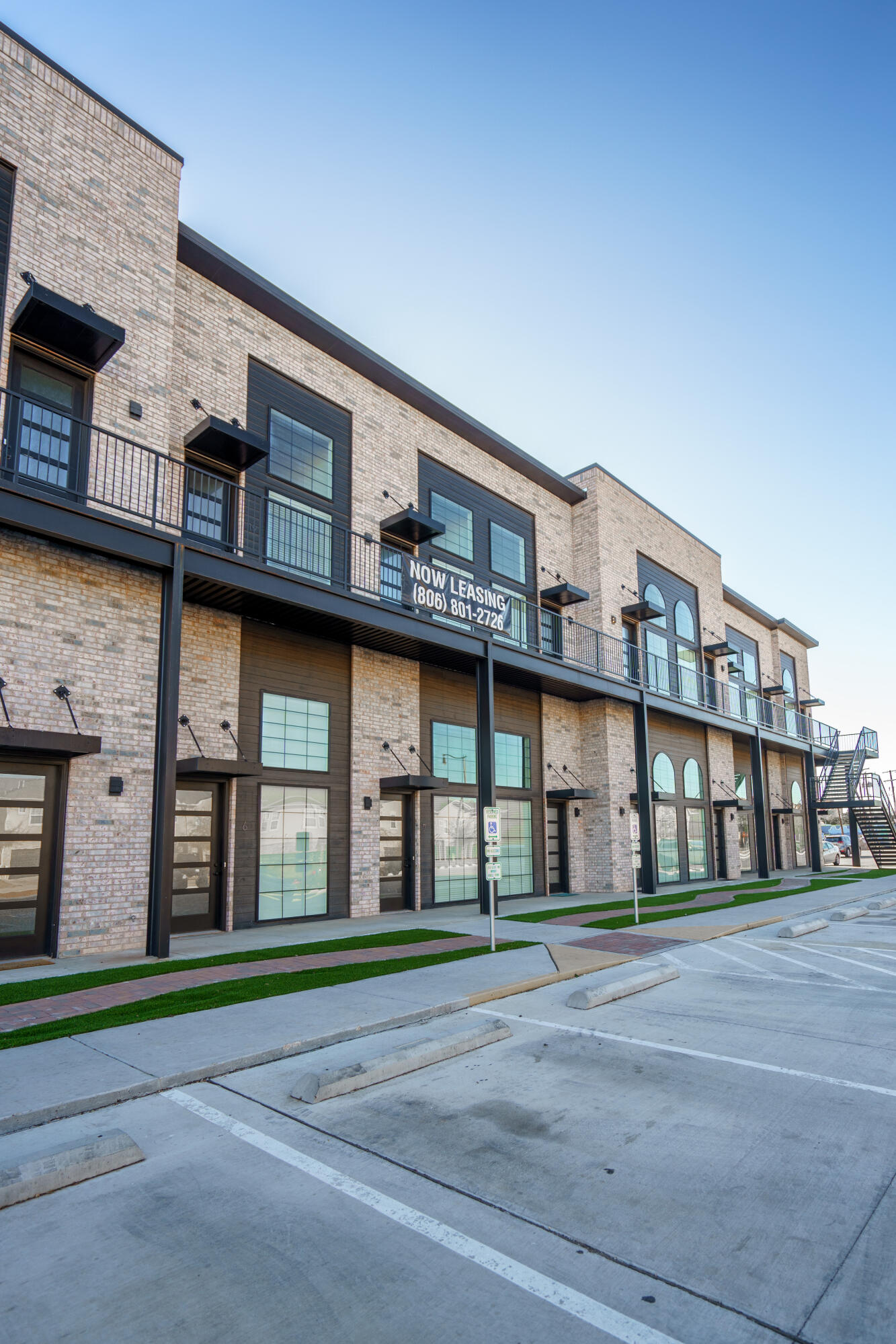 2007 Main Street, Unit 3 Lubbock, TX 79401 - Photo 22 of 23 a front view of building with a garden