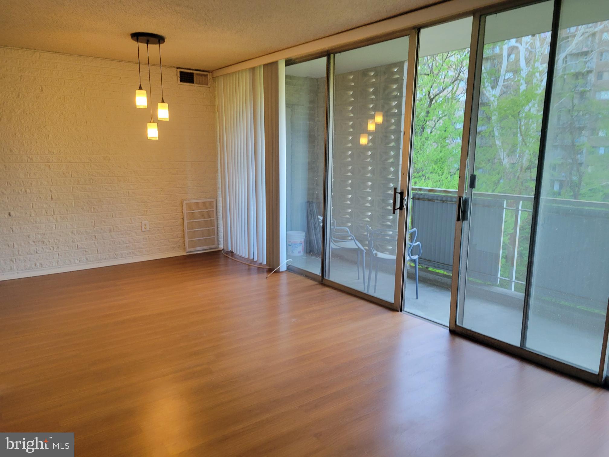 1830 Metzerott Road, Unit 103 Hyattsville, MD 20783 - Photo 11 of 41 a view of an empty room with glass door