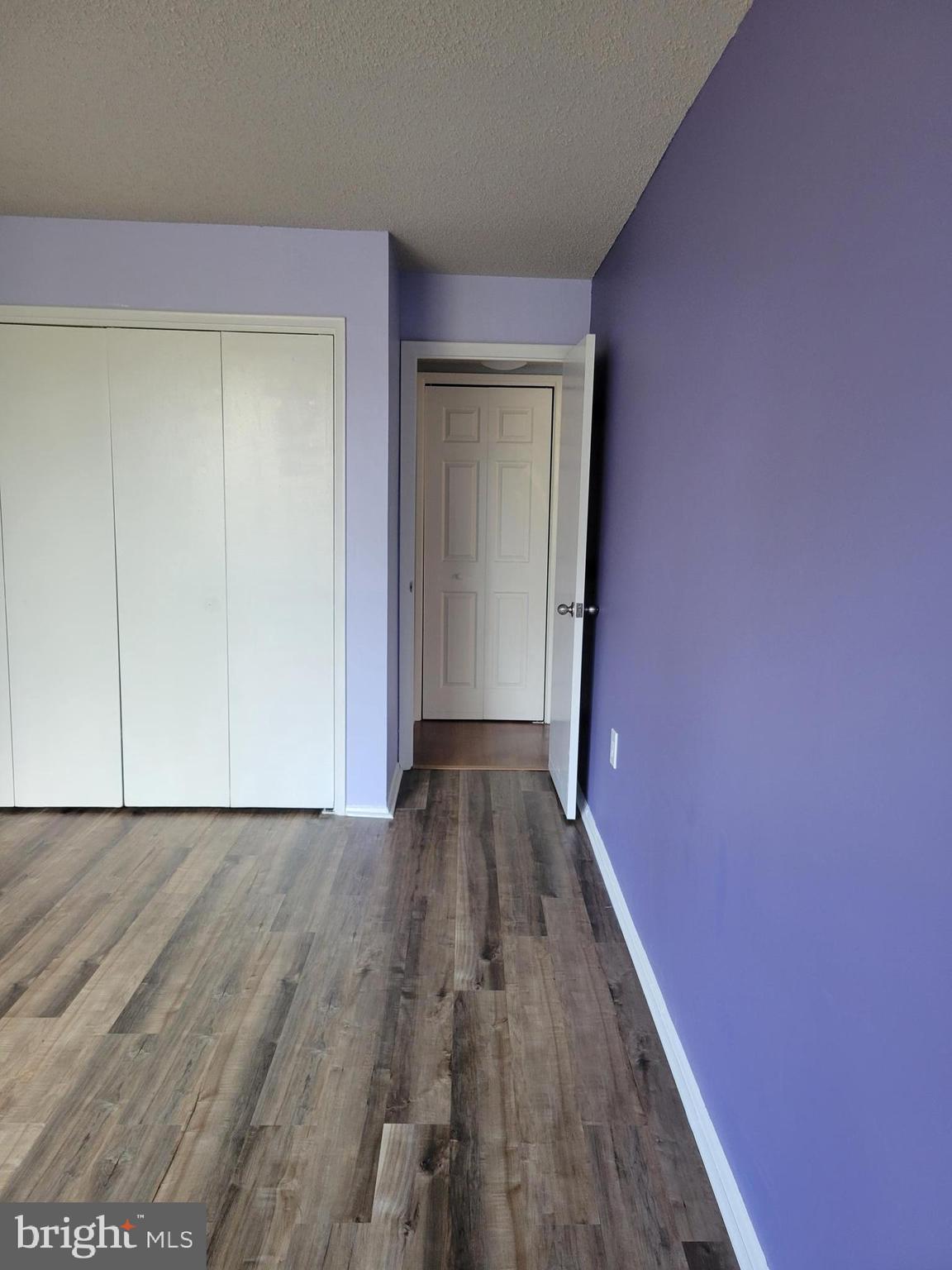 1830 Metzerott Road, Unit 103 Hyattsville, MD 20783 - Photo 19 of 41 a view of a hallway with wooden floor