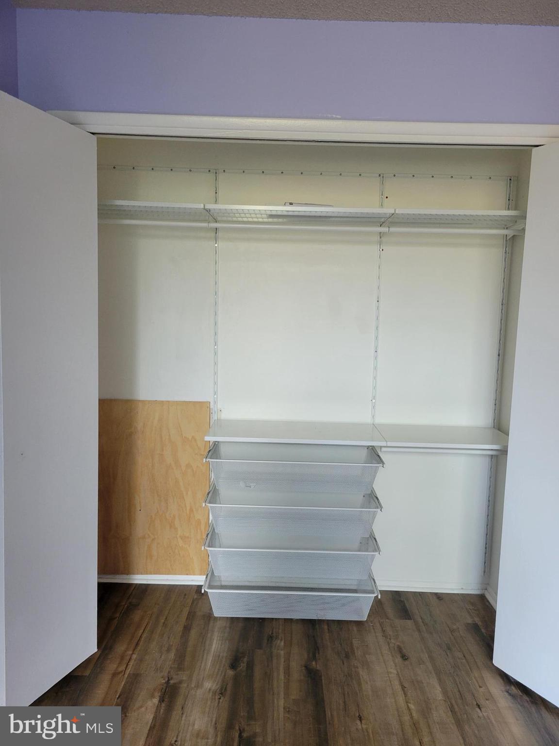 1830 Metzerott Road, Unit 103 Hyattsville, MD 20783 - Photo 21 of 41 a view of walk in closet with empty racks