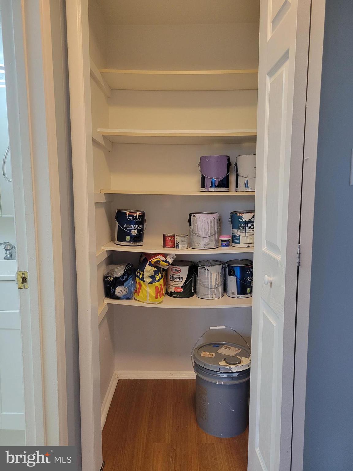 1830 Metzerott Road, Unit 103 Hyattsville, MD 20783 - Photo 25 of 41 a room with a stove and wooden floor