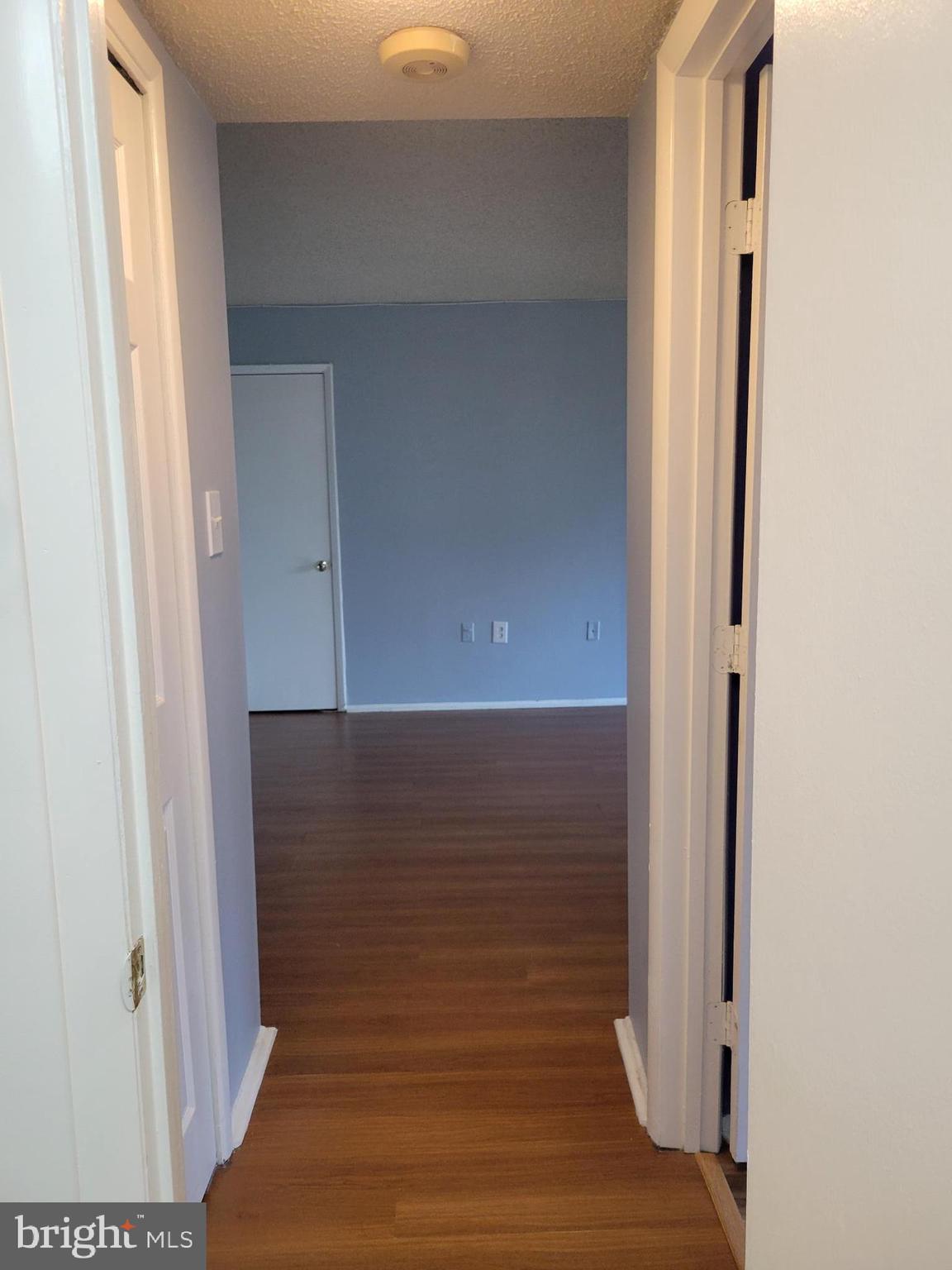1830 Metzerott Road, Unit 103 Hyattsville, MD 20783 - Photo 26 of 41 a view of a room with wooden floor