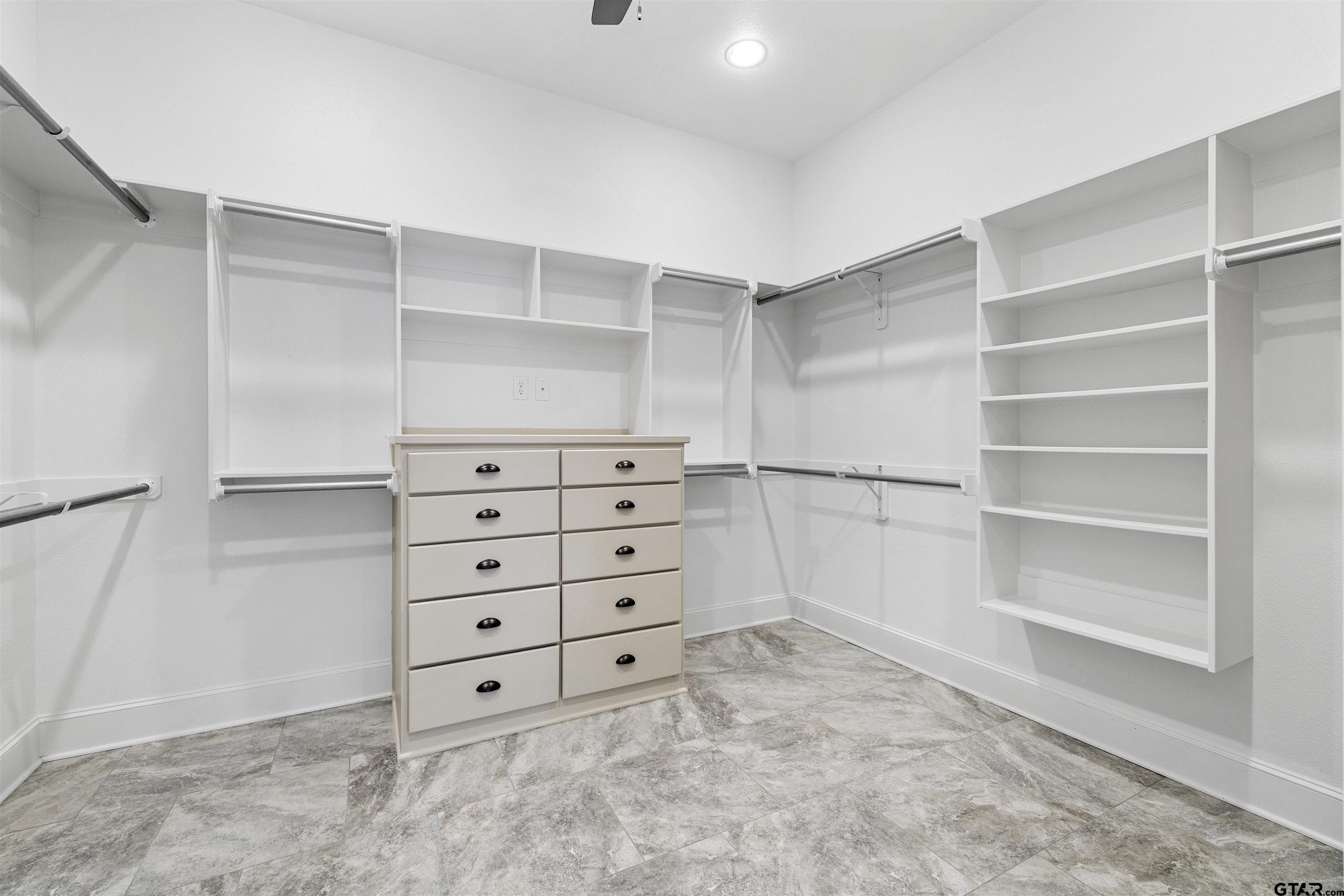 7384 Lake Pointe Cove Tyler, TX 75703 - Photo 10 of 18 a view of walk in closet with empty racks
