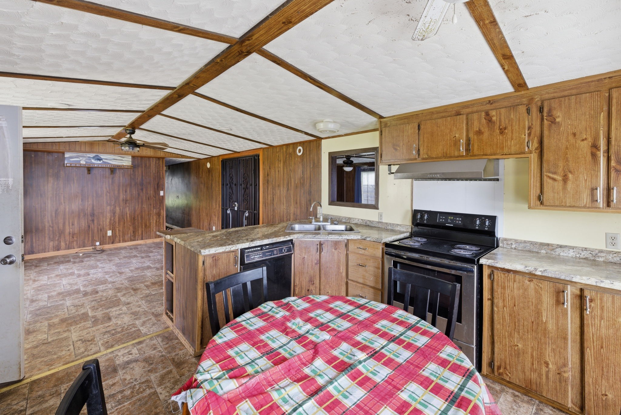 207 Center Street Portland, TN 37148 - Photo 10 of 26 a kitchen with a stove a sink and a refrigerator