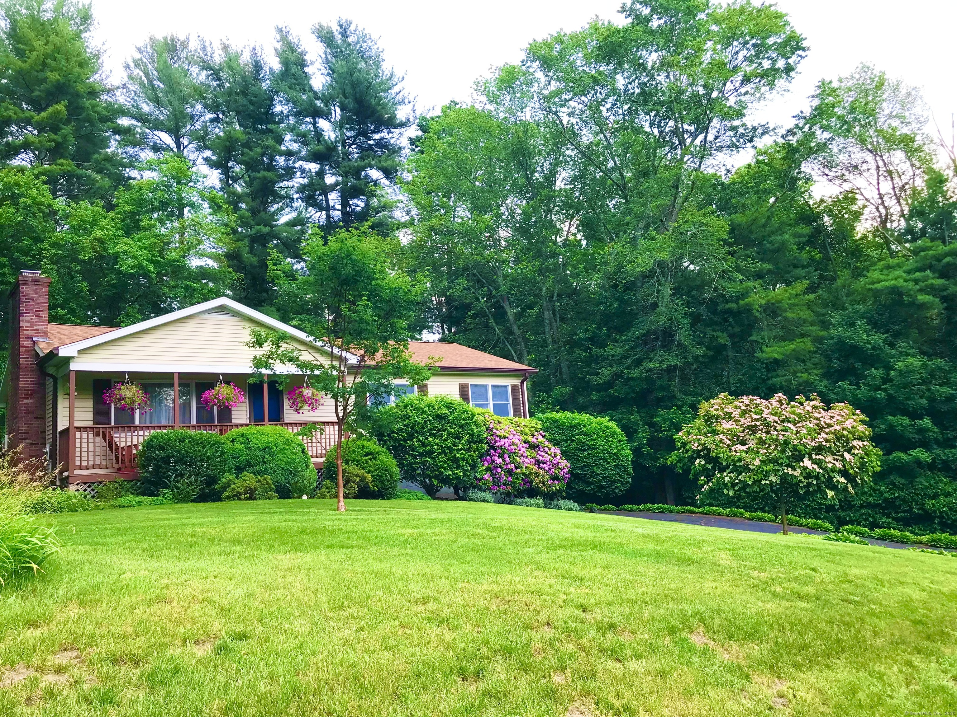 a front view of a house with garden