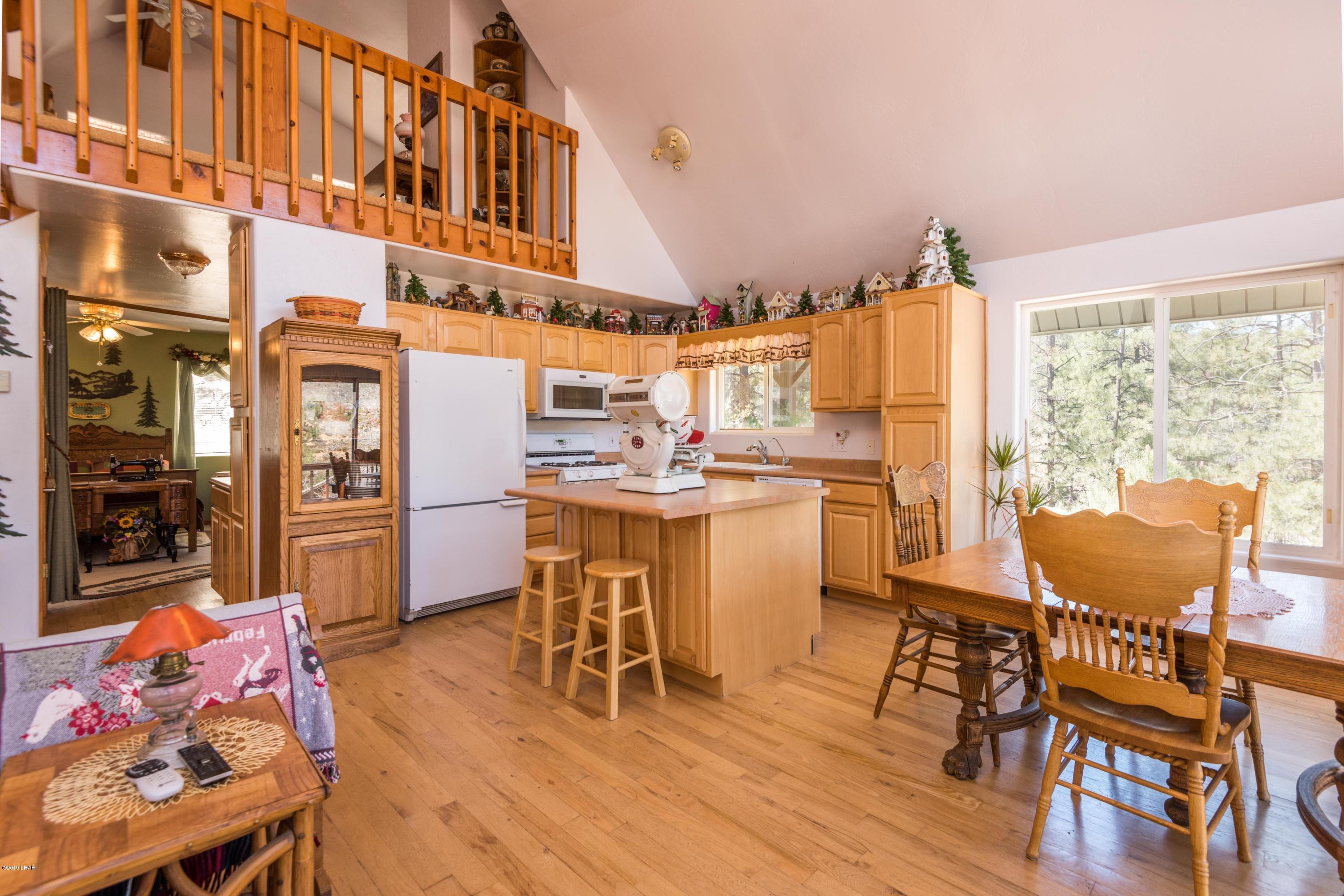 4690 South Hansen Road Kingman, AZ 86401 - Photo 12 of 94 Lots of wood making it a real cabin feel.