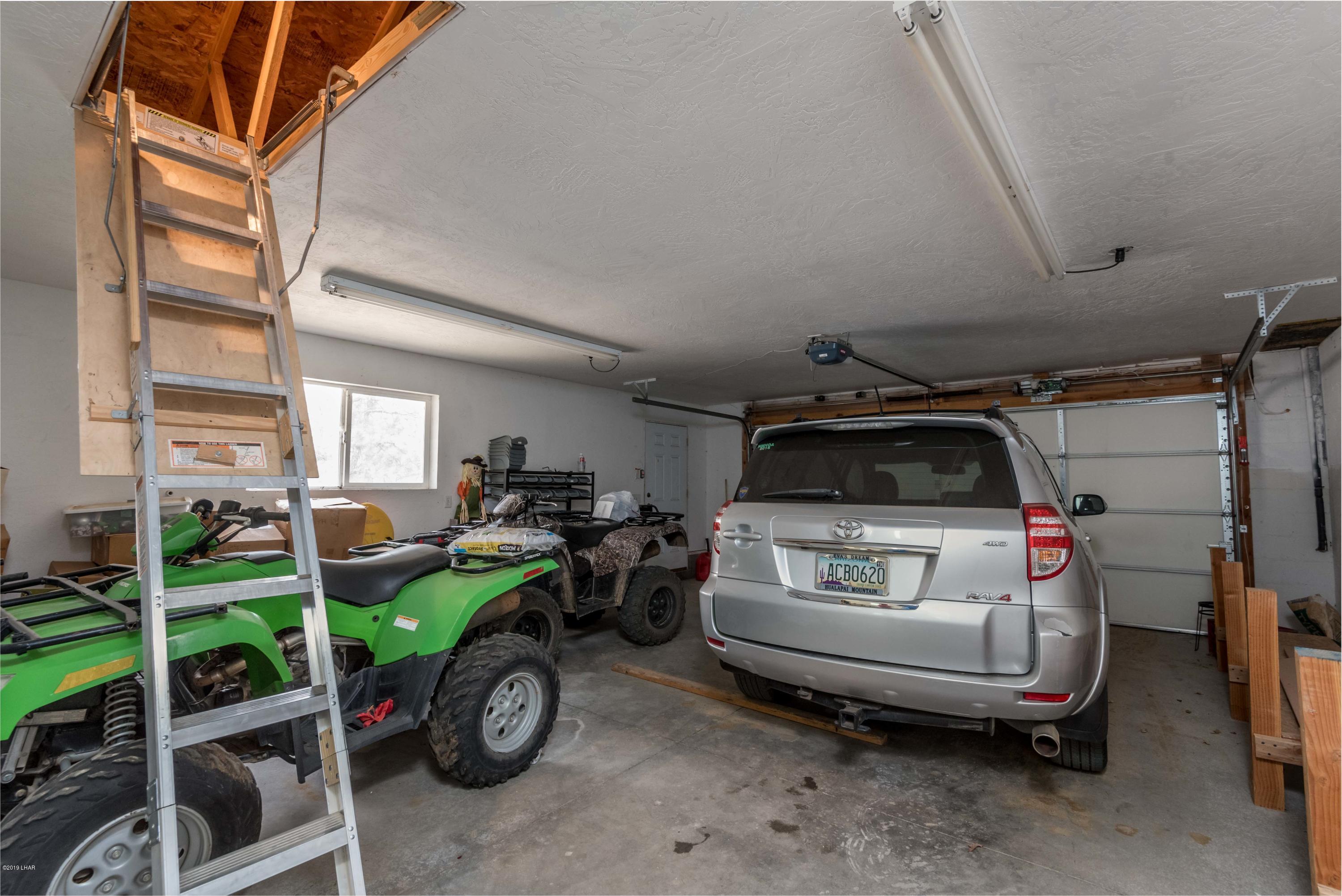 4690 South Hansen Road Kingman, AZ 86401 - Photo 46 of 94 Pull down ladder in garage to loft storage,
