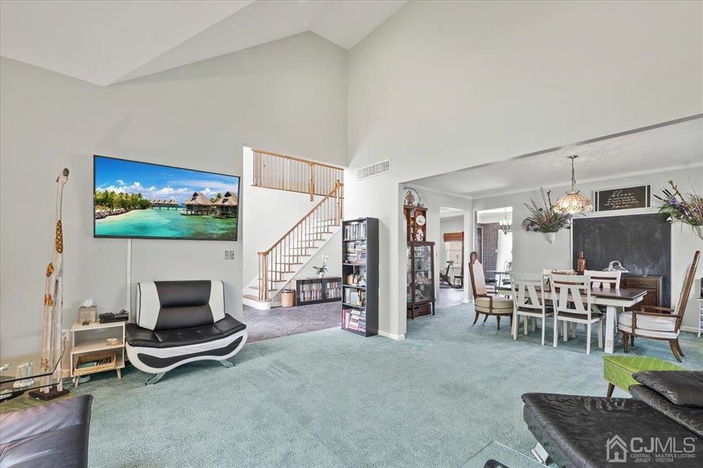 22 Mapleton Road Old Bridge, NJ 08857 - Photo 12 of 40 a room with furniture and a flat screen tv