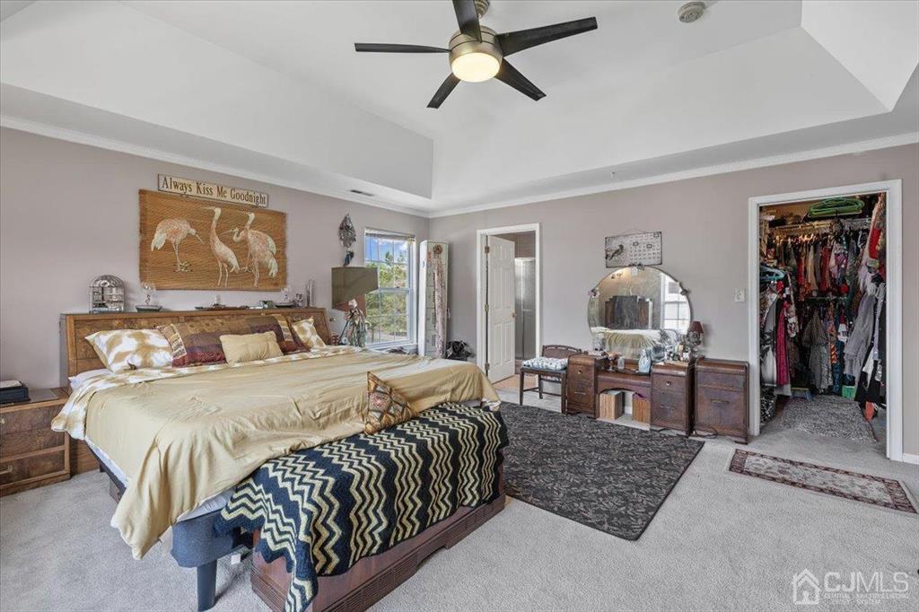 22 Mapleton Road Old Bridge, NJ 08857 - Photo 24 of 40 a bed room with a bed and a chandelier