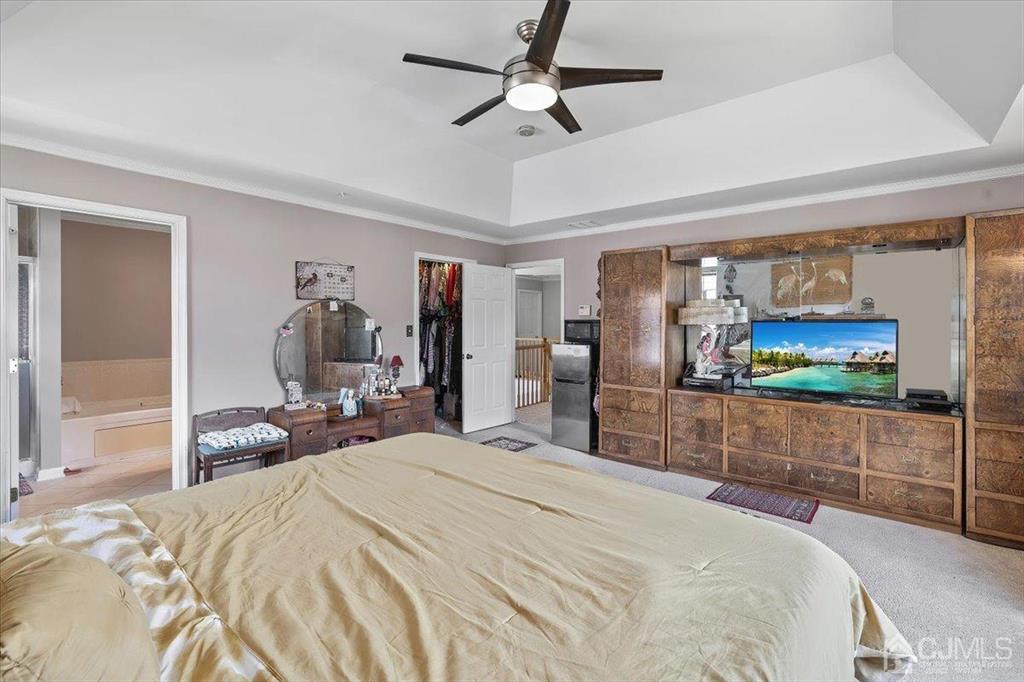 22 Mapleton Road Old Bridge, NJ 08857 - Photo 25 of 40 a bedroom with a bed and a flat screen tv