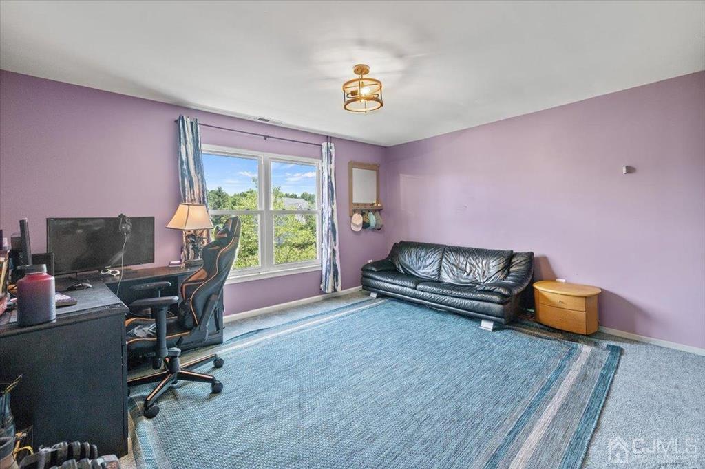22 Mapleton Road Old Bridge, NJ 08857 - Photo 30 of 40 a living room with furniture and a window