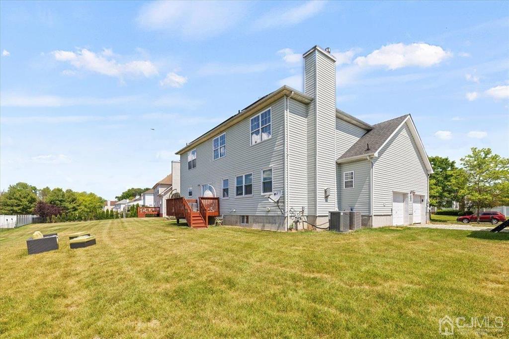 22 Mapleton Road Old Bridge, NJ 08857 - Photo 31 of 40 a front view of house with yard and lake