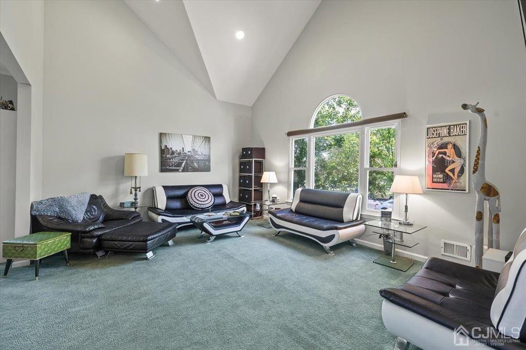 22 Mapleton Road Old Bridge, NJ 08857 - Photo 9 of 40 a living room with furniture gym equipment and a large window