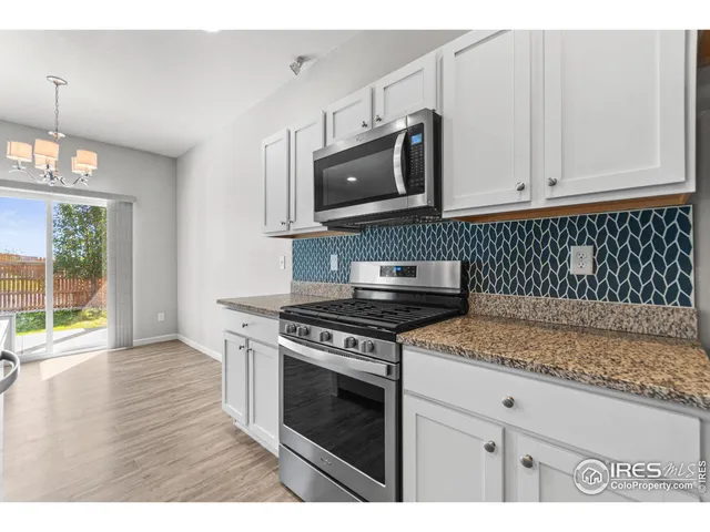 a kitchen with a stove and a microwave