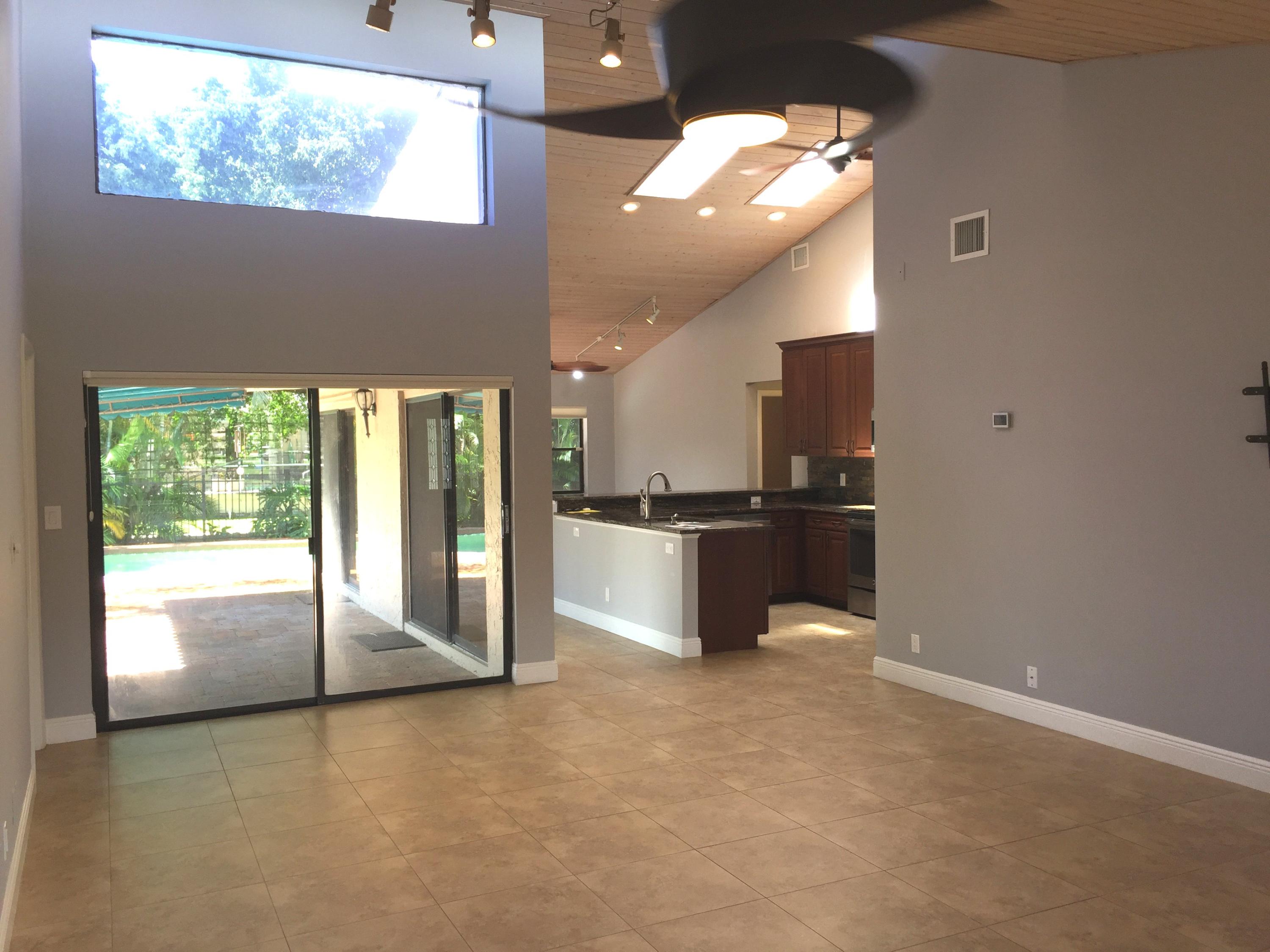 7220 Northwest 4th Avenue Boca Raton, FL 33487 - Photo 11 of 24 ADA Brown lr to kit