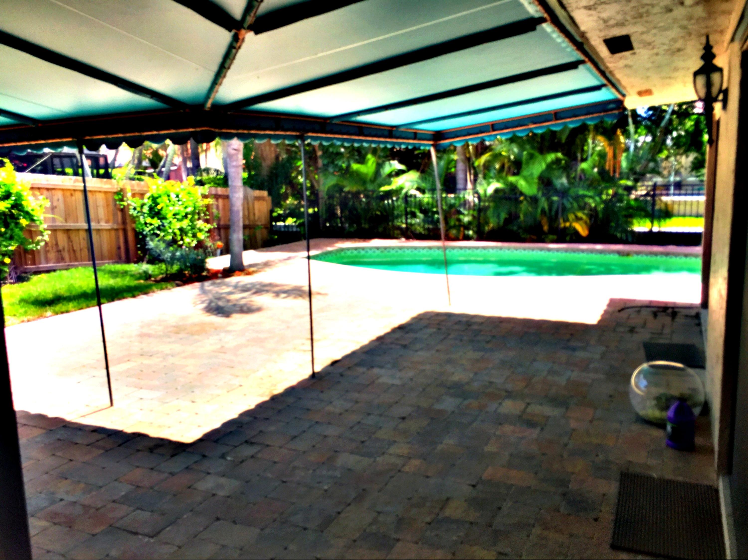 7220 Northwest 4th Avenue Boca Raton, FL 33487 - Photo 3 of 24 a BROWN PATIO TO POOL