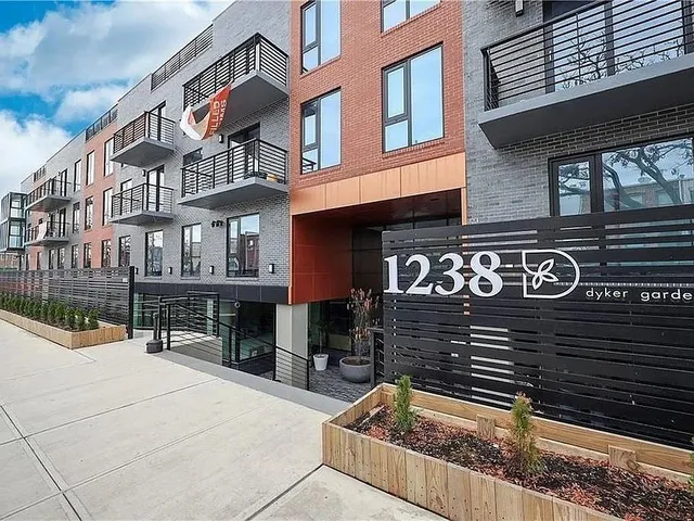 a sign on a pole on a street