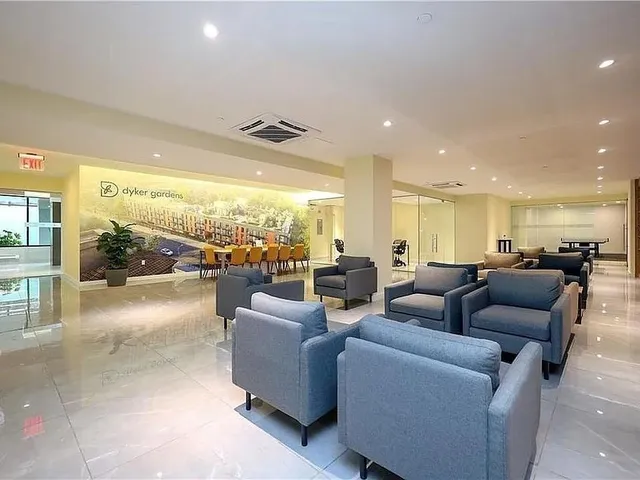 a living room with furniture and a large window with outer view