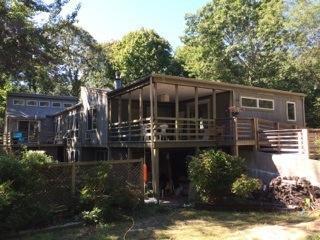 365 Chequessett Neck Road Wellfleet, MA 02667 - Photo 3 of 19 a view of a house with backyard and sitting area
