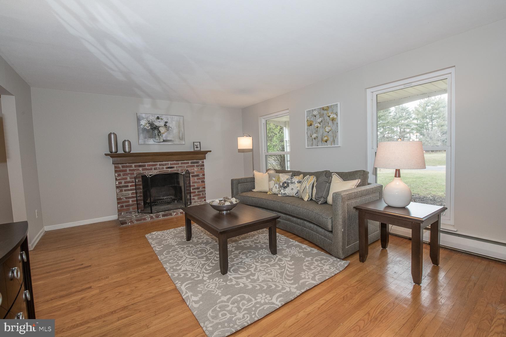 12 Ashlawn Road Malvern, PA 19355 - Photo 4 of 33 Living Room has a wood-burning fireplace.