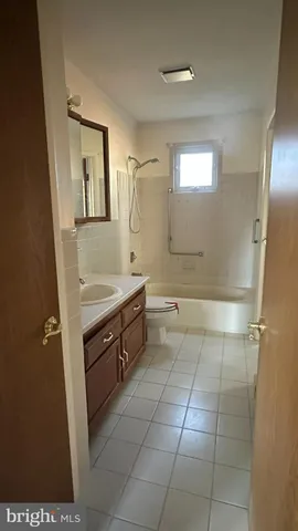 a bathroom with a sink a vanity and a mirror