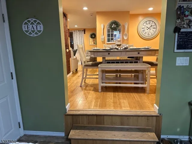 a view of kitchen island with furniture and clock