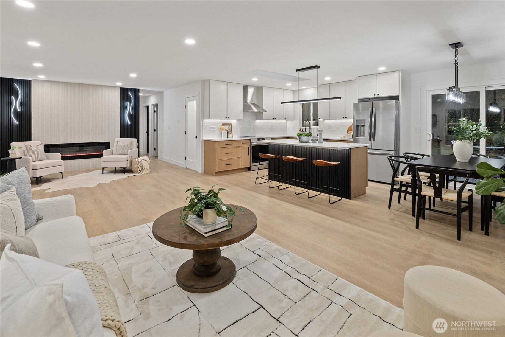12528 Odell Road Northeast Duvall, WA 98019 - Photo 16 of 39 a living room with furniture a refrigerator and kitchen view