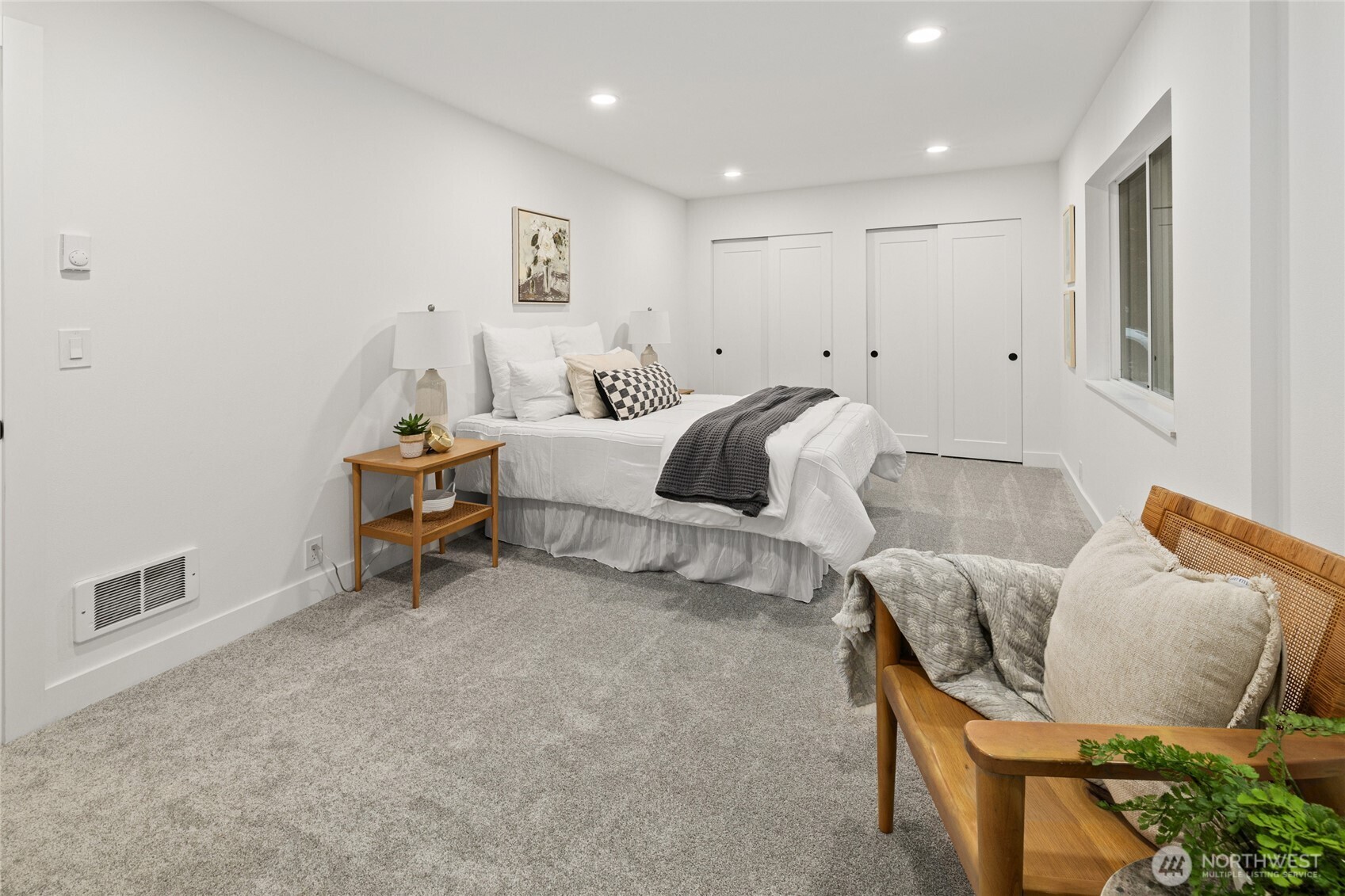 12528 Odell Road Northeast Duvall, WA 98019 - Photo 21 of 39 a bedroom with furniture and a wooden floor