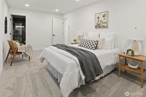 a bedroom with a bed and a chair