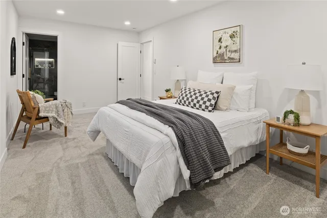 a bedroom with a bed and a chair