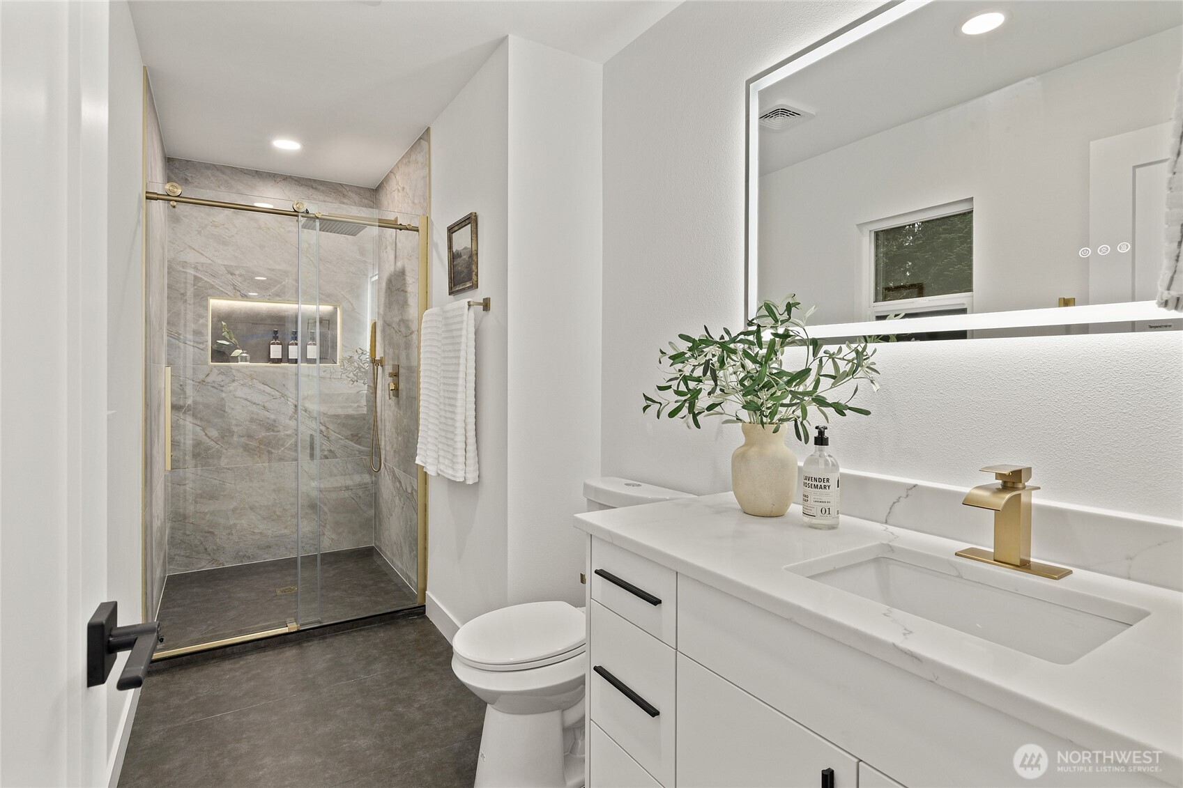 12528 Odell Road Northeast Duvall, WA 98019 - Photo 23 of 39 a bathroom with a sink a toilet and shower