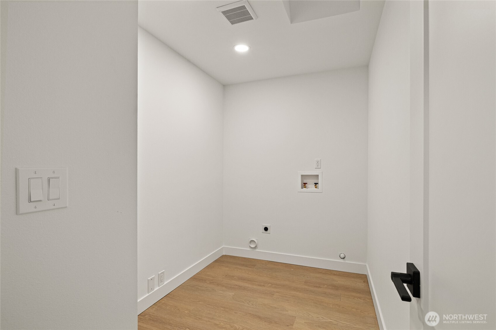 12528 Odell Road Northeast Duvall, WA 98019 - Photo 25 of 39 a view of a room with a white wall and a window