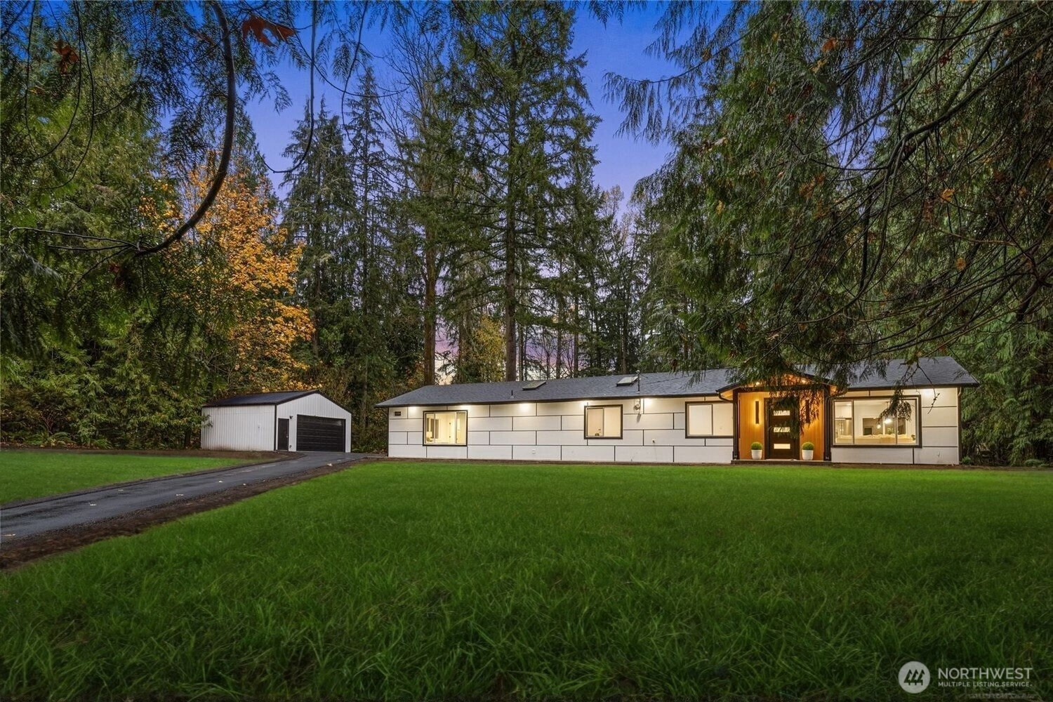 12528 Odell Road Northeast Duvall, WA 98019 - Photo 3 of 39 a front view of a house with garden